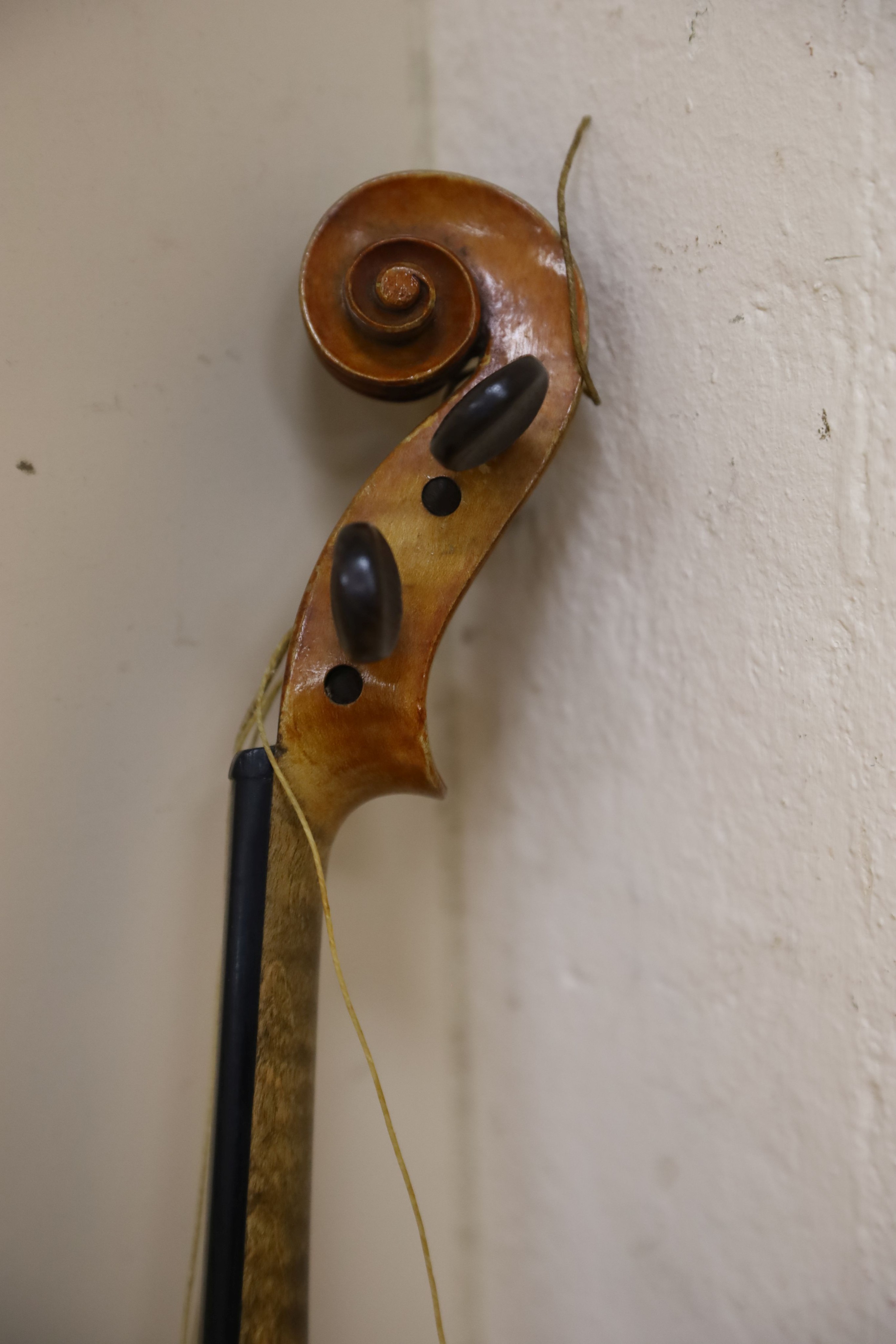 A Stradivarius copy violin and two bows and another bow, both cased, backs 33cm and 30cm